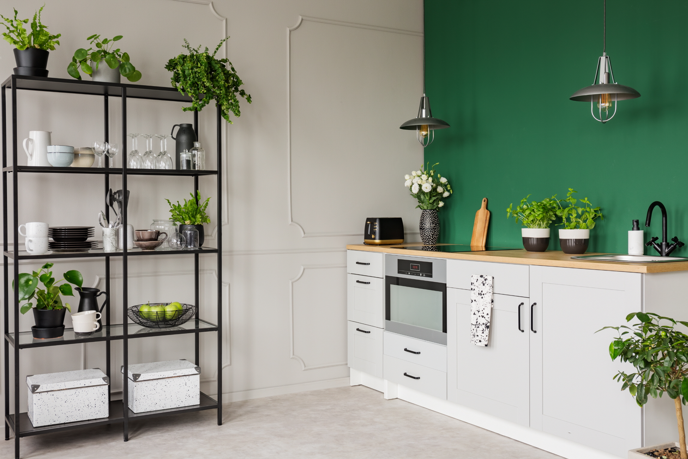 Use vivid colors and reflective paint in small kitchens to enhance space and brightness.