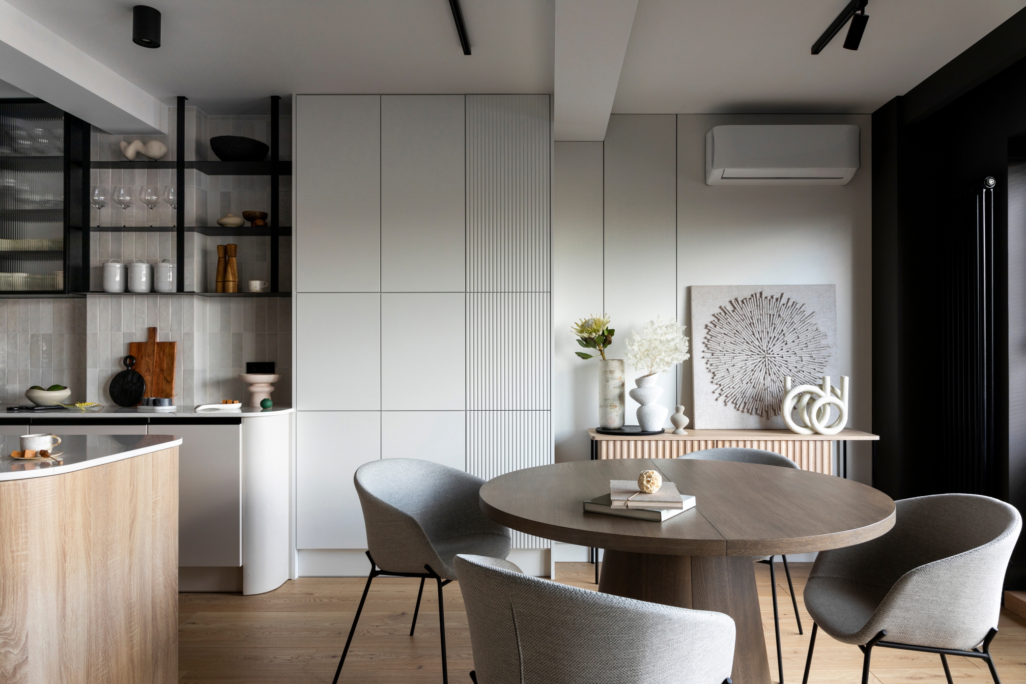 Create a warm and inviting dining area by placing a round bistro table in your kitchen.