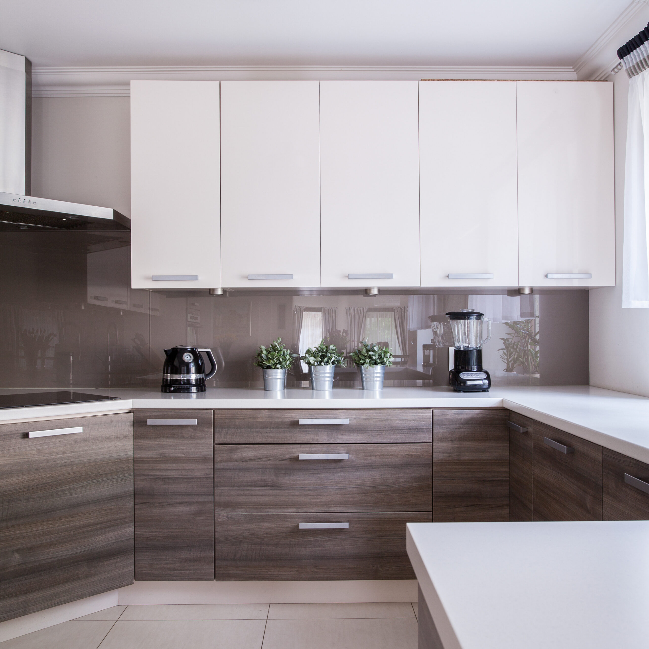 Incorporating high-gloss finishes can significantly enhance the light and brightness of your kitchen, especially in compact spaces.