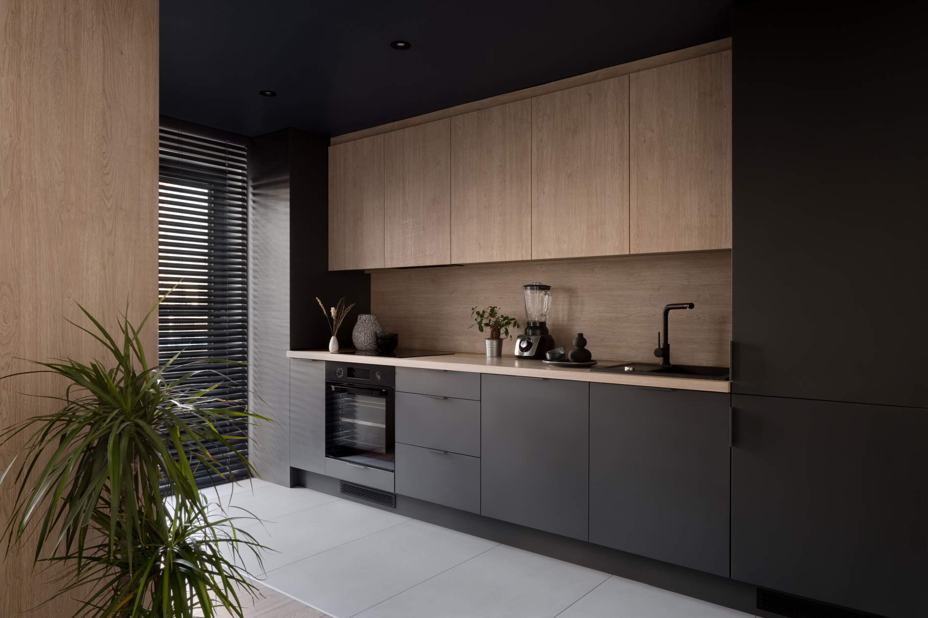 Pairing wood accents with black countertops creates a balance between the warmth of wood and the sophistication of black.